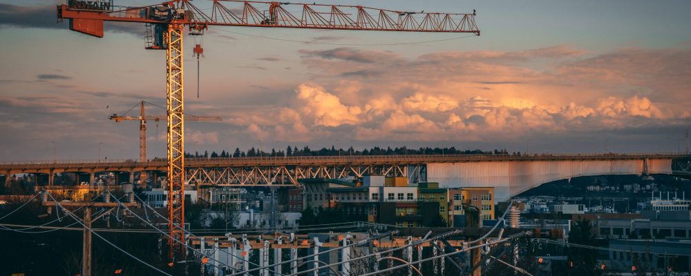 A beautiful view of a construction site in a city during sunset